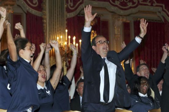659814-french-president-francois-hollande-c-reacts-as-the-french-national-football-team-scores-a-goal-again